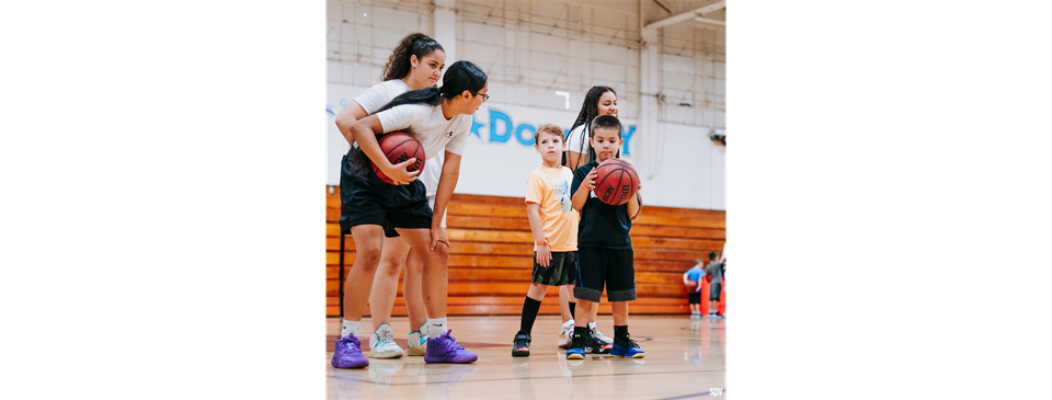 Downey High School basketball players volunteering their time to help coach youth programs 